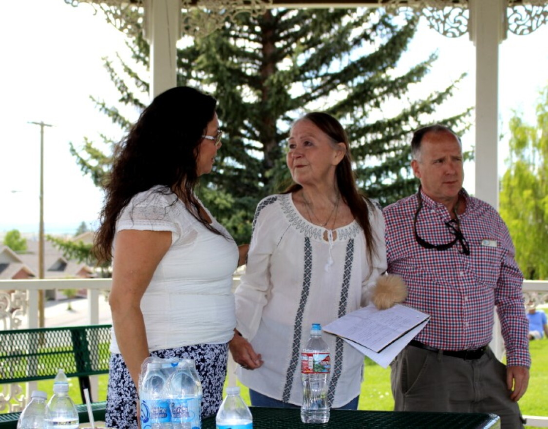 Cheryl Eagle (L) with Indian People's Action, and Geoff Gallus (R) with the Butte Area Rising Coalition, comfort Miki Chessmore (M), who's house was spray painted with racial slurs in early June. June 15, 2019.